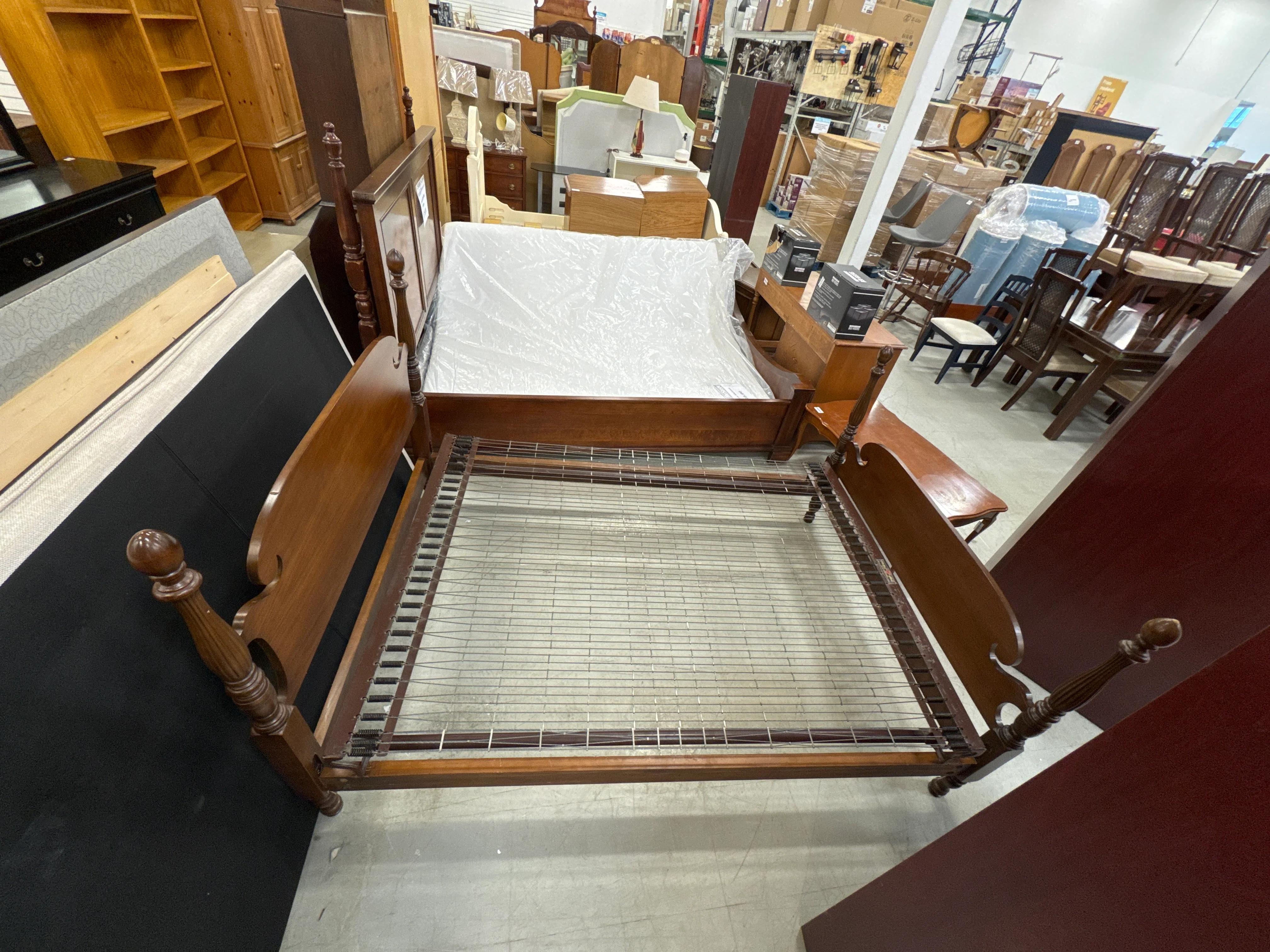 Vintage Wooden Bed Frame with a Cannonball Poster Design and an Integrated Wire Spring Base. - Image 2